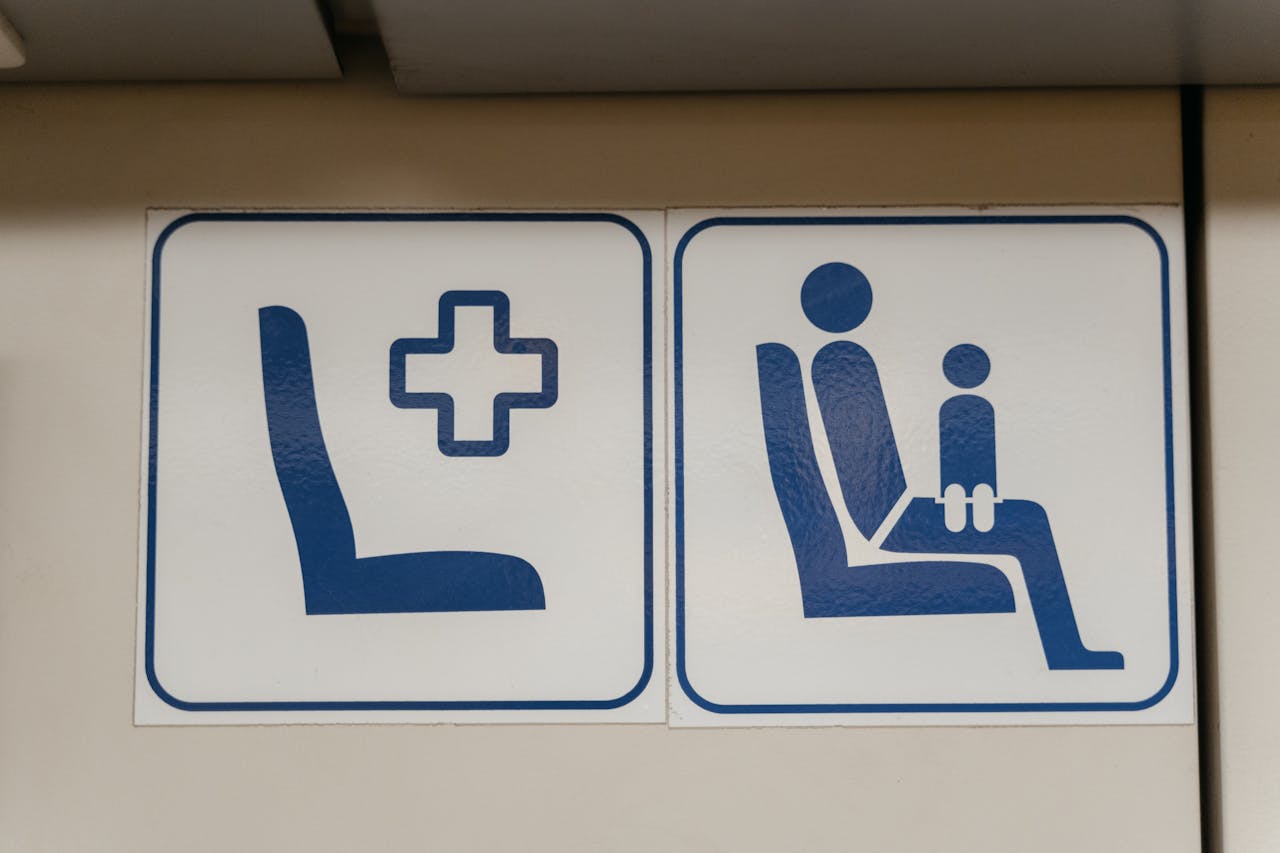 Blue pictogram signs indicating reserved seating on public transport.